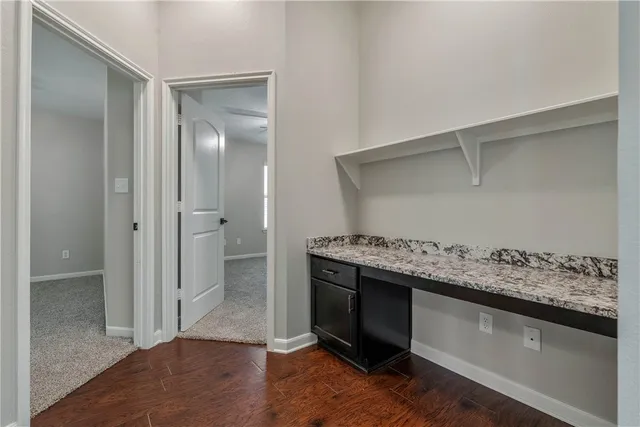 a view of cabinets and wooden floor