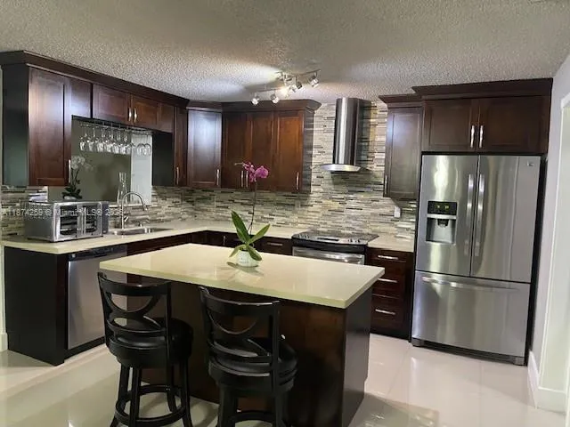 a kitchen with a stove and a microwave