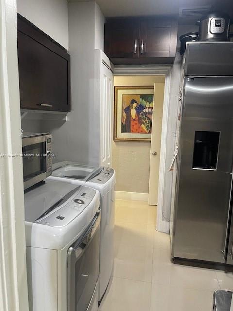 2701 Southwest 79th Avenue Miami, FL 33155 - Photo 12 of 53 a kitchen with a stove and a microwave