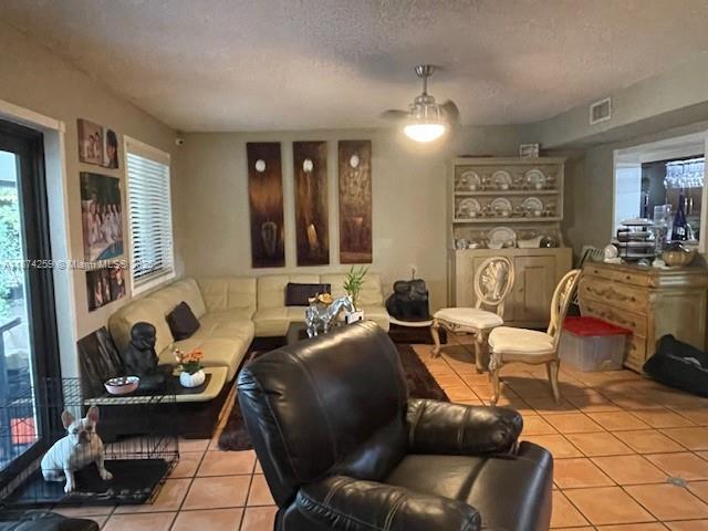 2701 Southwest 79th Avenue Miami, FL 33155 - Photo 14 of 53 a living room with furniture a large window and gym equipment