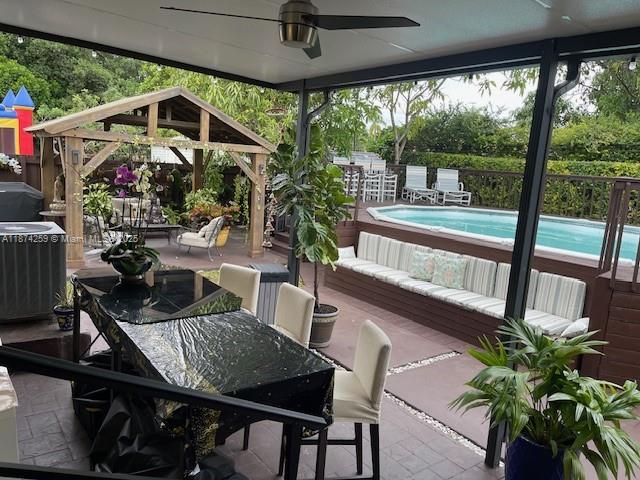 2701 Southwest 79th Avenue Miami, FL 33155 - Photo 21 of 53 a view of a patio with a table chairs and a potted plant