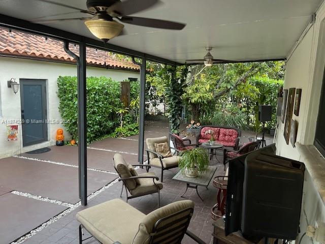 2701 Southwest 79th Avenue Miami, FL 33155 - Photo 26 of 53 a living room with furniture and a floor to ceiling window
