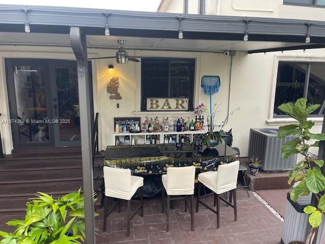 2701 Southwest 79th Avenue Miami, FL 33155 - Photo 28 of 53 a view of a patio with table and chairs potted plants