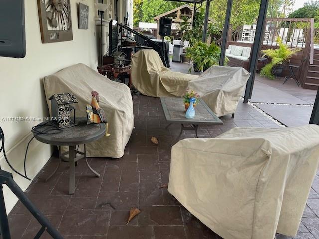 2701 Southwest 79th Avenue Miami, FL 33155 - Photo 29 of 53 a living room with furniture and a potted plant