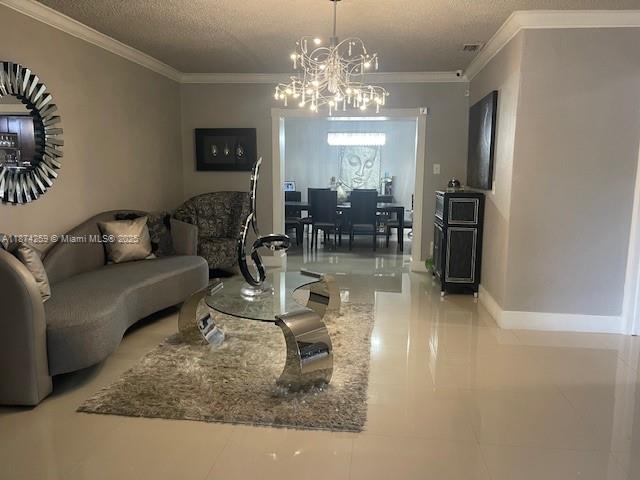 2701 Southwest 79th Avenue Miami, FL 33155 - Photo 4 of 53 a living room with furniture and a chandelier