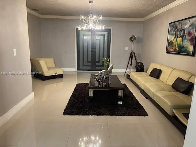2701 Southwest 79th Avenue Miami, FL 33155 - Photo 45 of 53 a living room with furniture and a chandelier