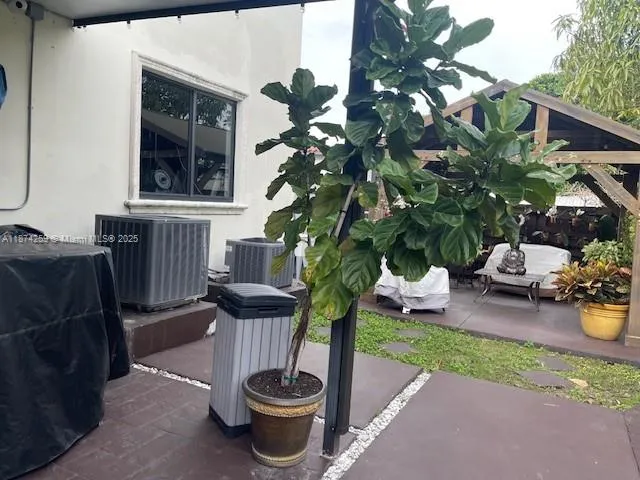 a backyard of a house with table and chairs