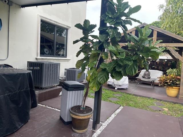 2701 Southwest 79th Avenue Miami, FL 33155 - Photo 47 of 53 a view of a porch with chairs and potted plants