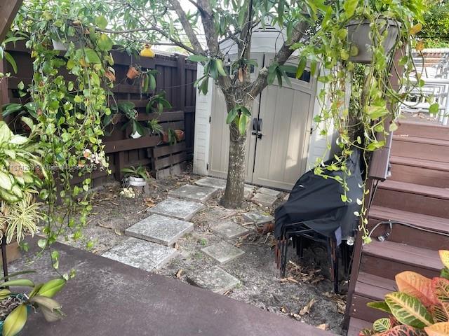 2701 Southwest 79th Avenue Miami, FL 33155 - Photo 50 of 53 a backyard of a house with table and chairs