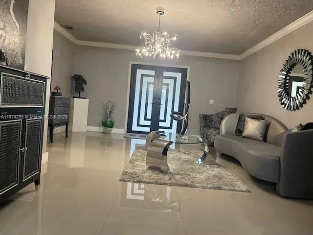 a dining room with furniture and chandelier