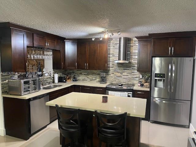 2701 Southwest 79th Avenue Miami, FL 33155 - Photo 9 of 53 a kitchen with stainless steel appliances granite countertop a sink and a refrigerator