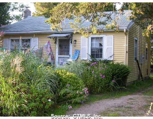 Exterior Front. This adorable cottage is steps away to salt pond & private beach