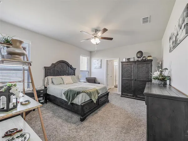 a bedroom with a bed and a couch