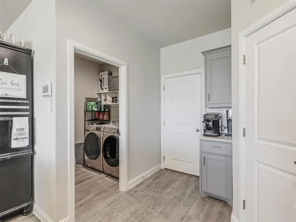 a view of a kitchen with washer and dryer