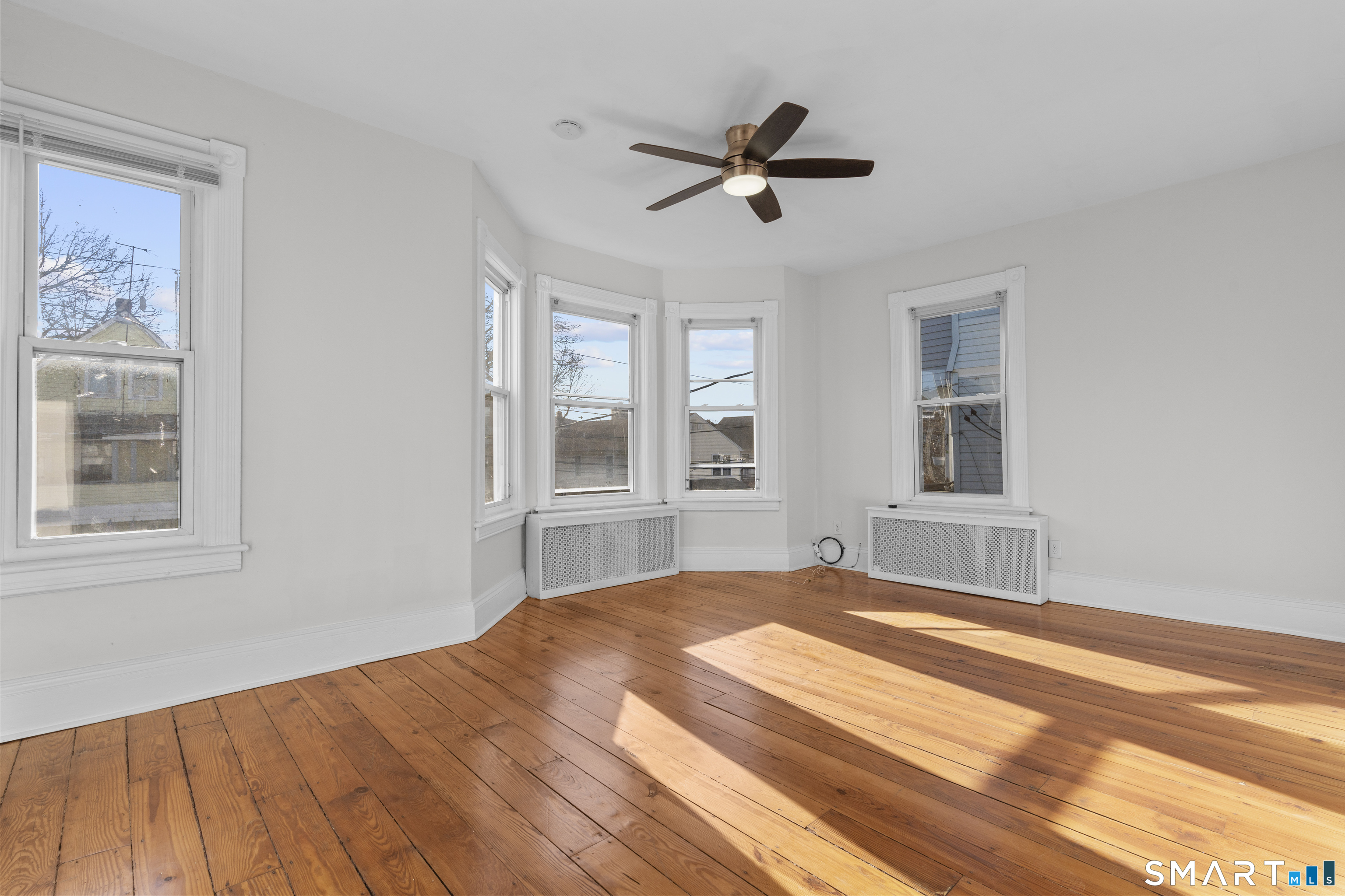 394 Gregory Street, Unit 1 Bridgeport, CT 06604 - Photo 12 of 23 a bedroom with a bed and a window