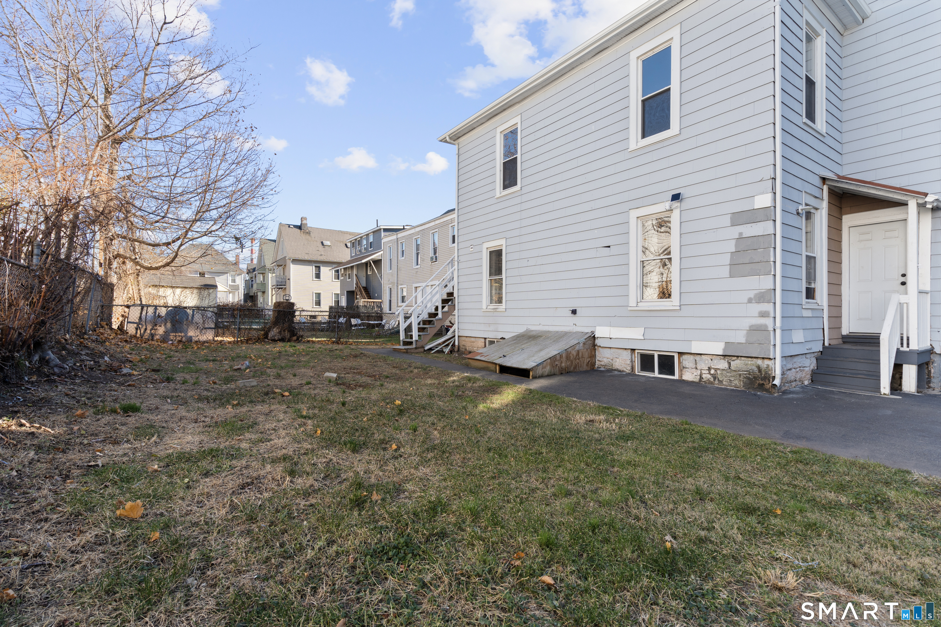 394 Gregory Street, Unit 1 Bridgeport, CT 06604 - Photo 23 of 23 a view of a house with a yard