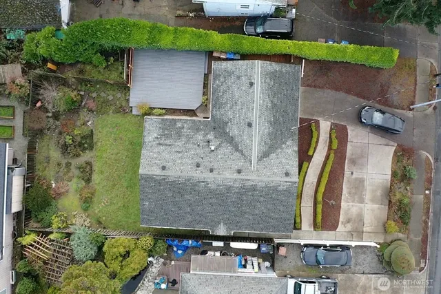 an aerial view of a house with a yard