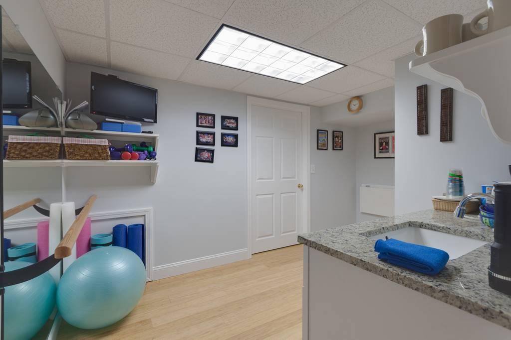 131 Abbey Gate Road Cotuit, MA 02635 - Photo 24 of 34 a living room with furniture and a flat screen tv