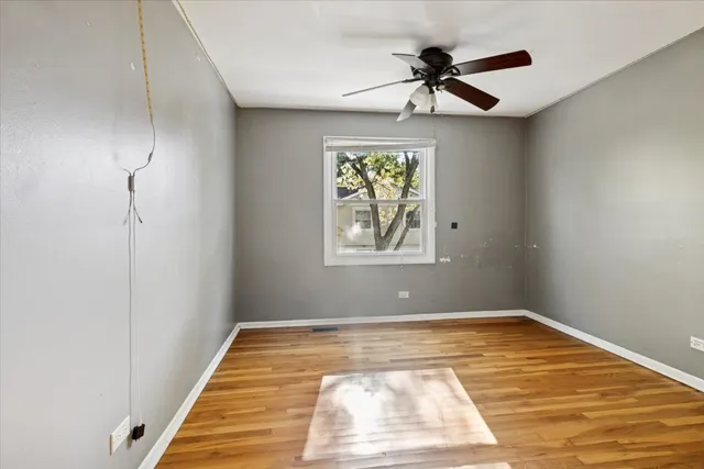 a view of room with window and ceiling fan