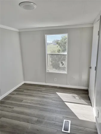 a kitchen with a refrigerator a sink and cabinets