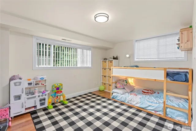 a bedroom with furniture and a window