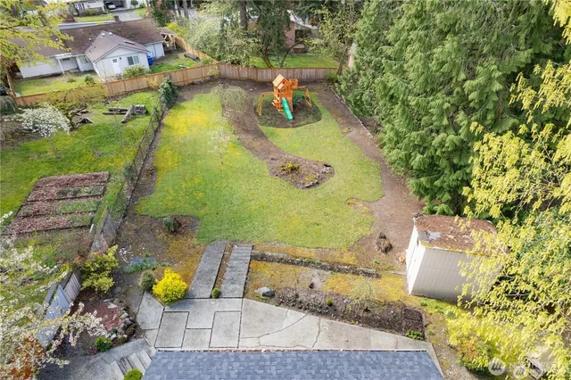 an aerial view of residential houses with outdoor space