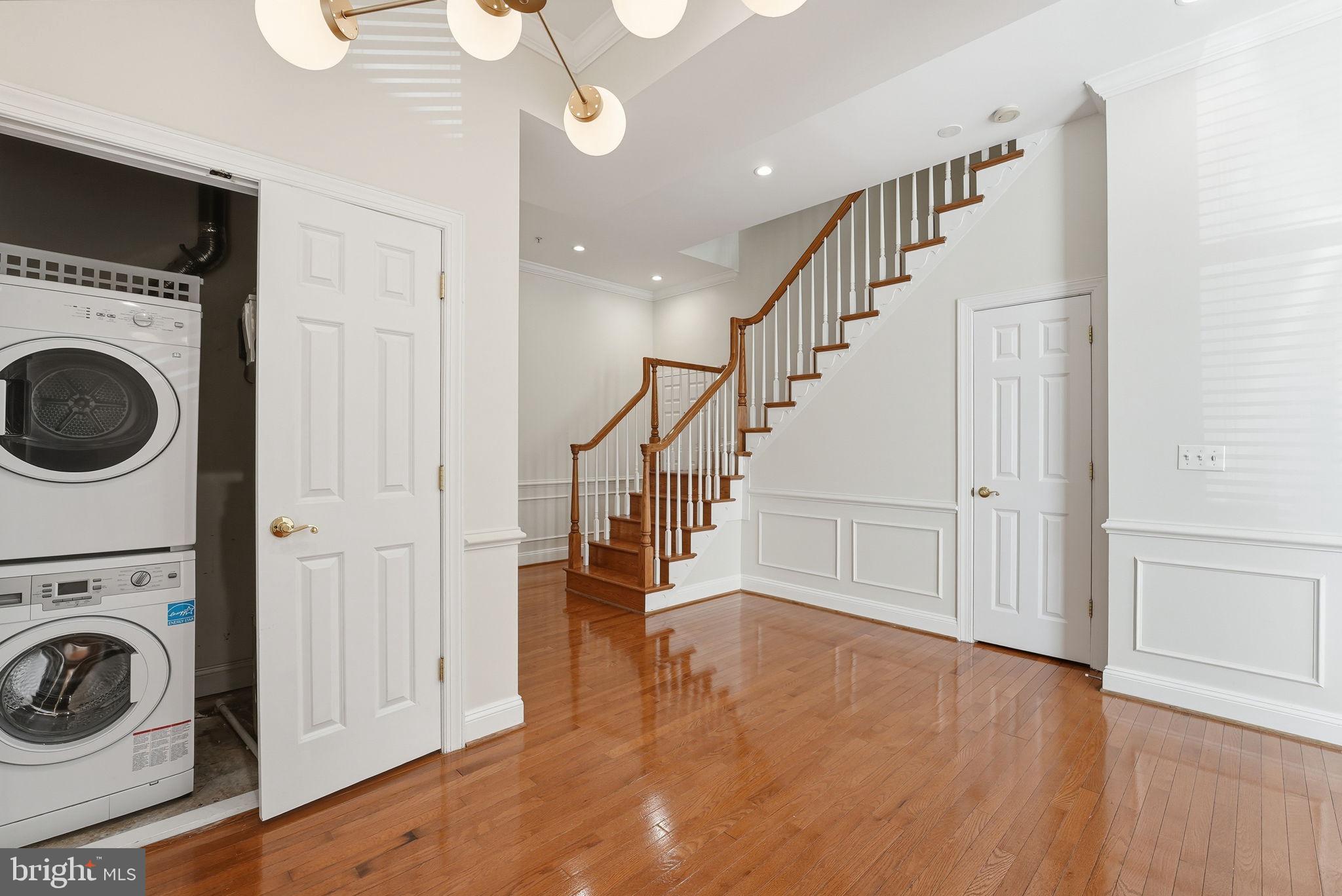 1229 12th Street Northwest, Unit 109 Washington, DC 20005 - Photo 11 of 23 a view of a hallway with washer and dryer