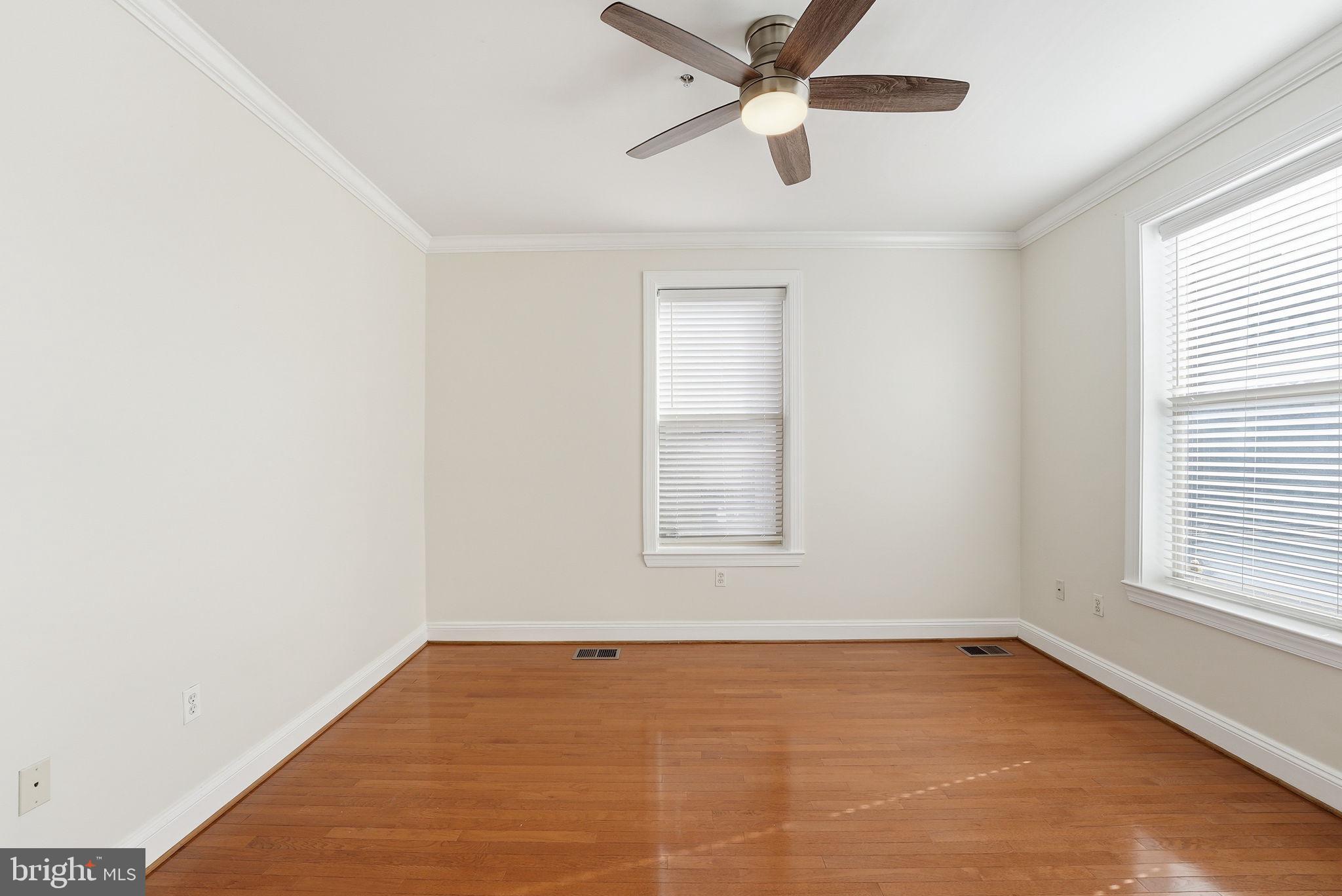 1229 12th Street Northwest, Unit 109 Washington, DC 20005 - Photo 17 of 23 an empty room with a window and a fan