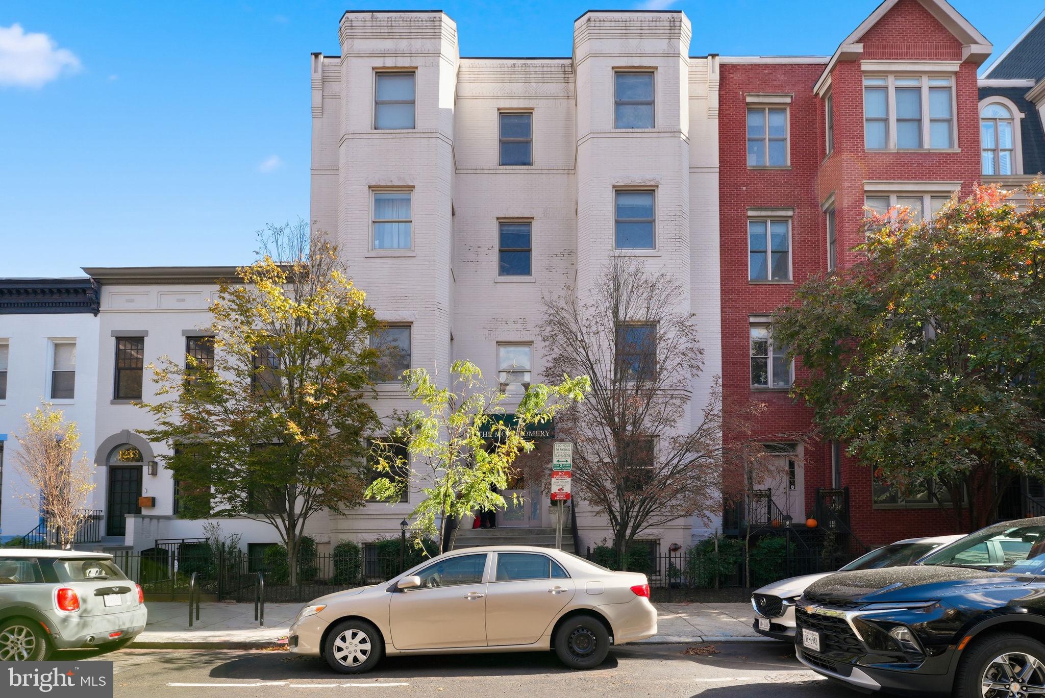 1229 12th Street Northwest, Unit 109 Washington, DC 20005 - Photo 2 of 23 a car parked in front of a building