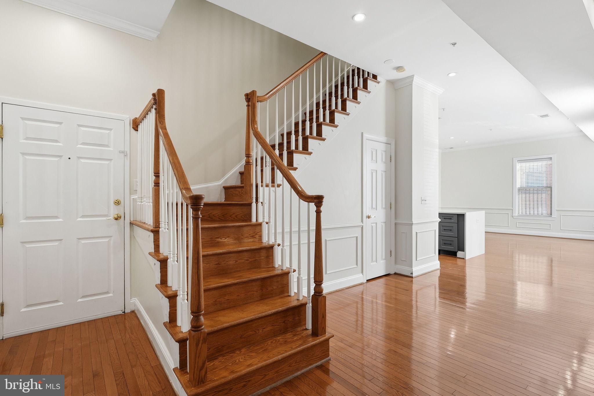 1229 12th Street Northwest, Unit 109 Washington, DC 20005 - Photo 3 of 23 a view of entryway with wooden floor and stairs