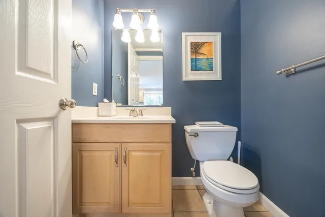 a view of a kitchen with wooden floor and electronic appliances
