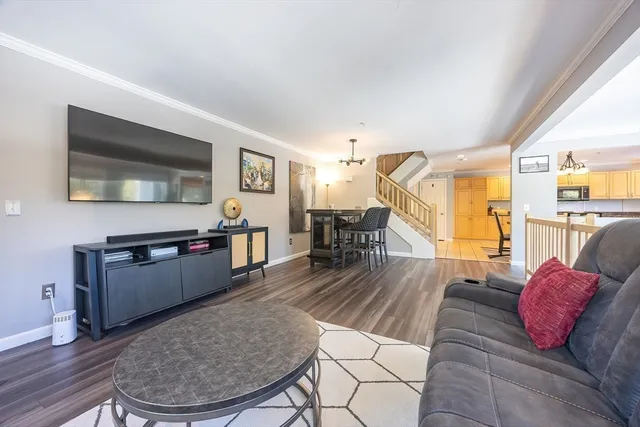a living room with a bed furniture and a fireplace