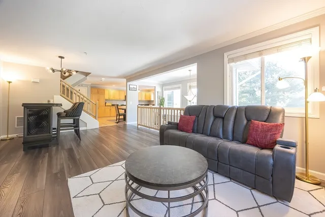 a bedroom with furniture window and wooden floor