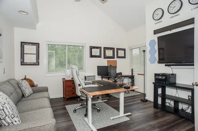 a view of a livingroom with furniture and a flat screen tv