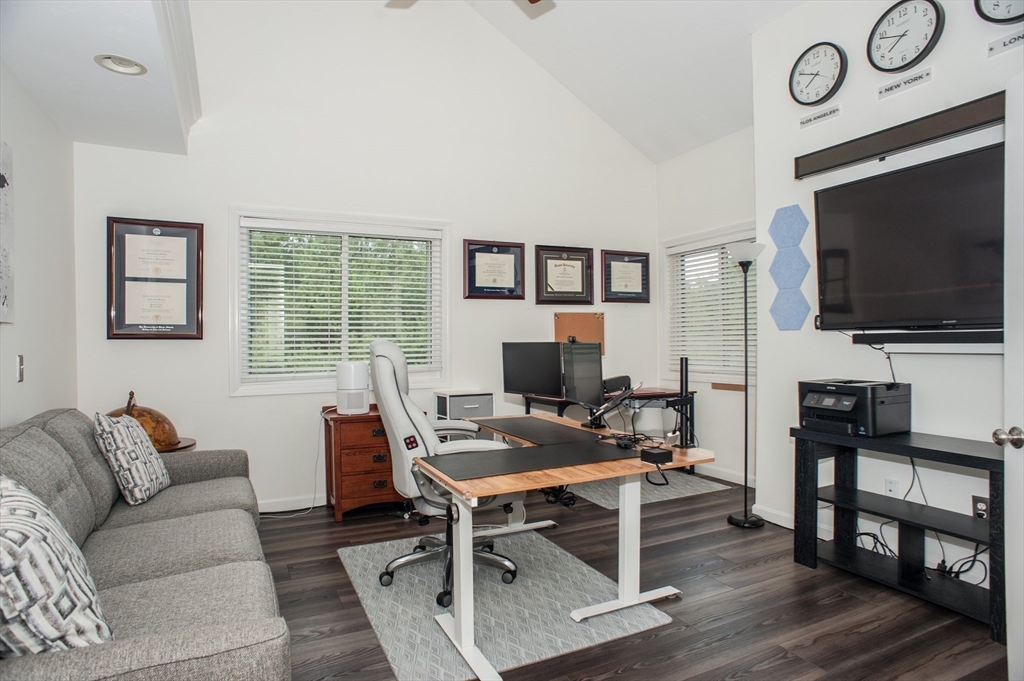 1501 Old Bridge Lane, Unit 1501 Bellingham, MA 02019 - Photo 18 of 42 a view of a livingroom with furniture and a flat screen tv