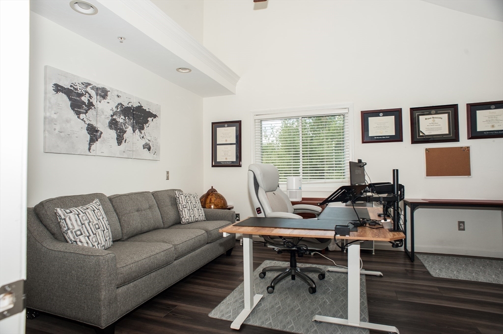 1501 Old Bridge Lane, Unit 1501 Bellingham, MA 02019 - Photo 19 of 42 a living room with furniture and a window