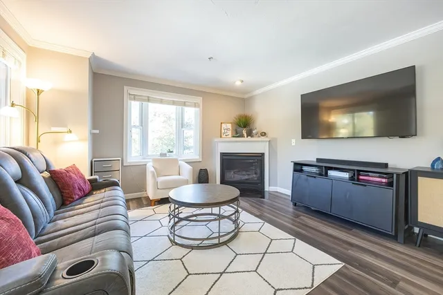 a spacious bedroom with a bed and wooden floor