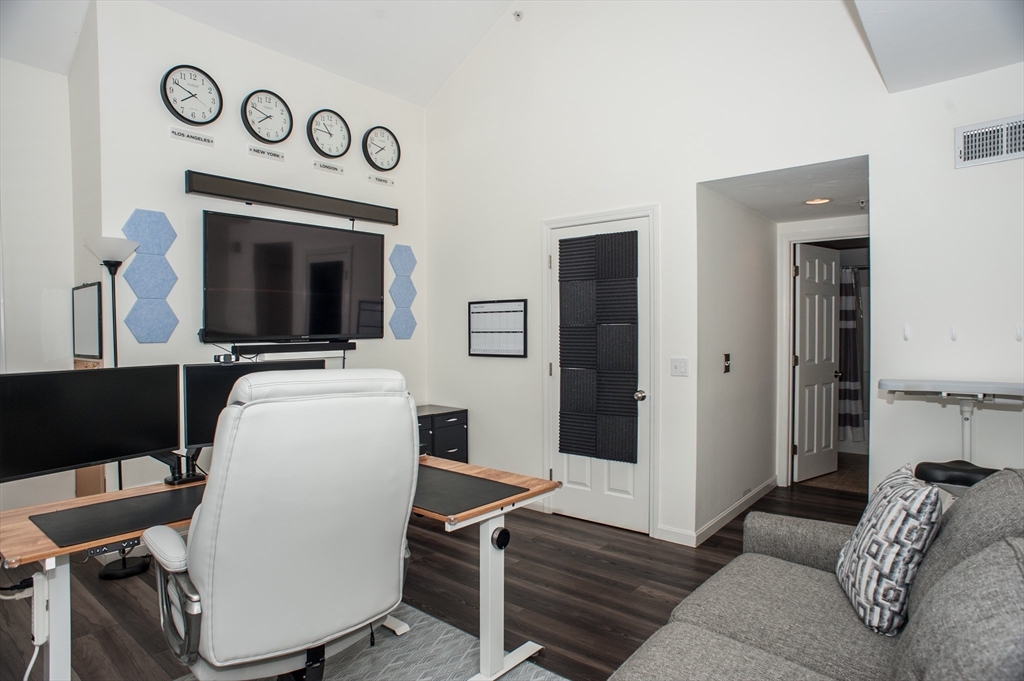 1501 Old Bridge Lane, Unit 1501 Bellingham, MA 02019 - Photo 20 of 42 a living room with furniture and a flat screen tv