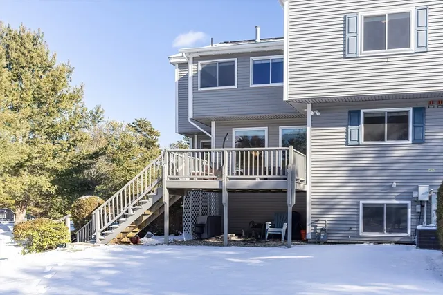 a view of front door of house with stairs