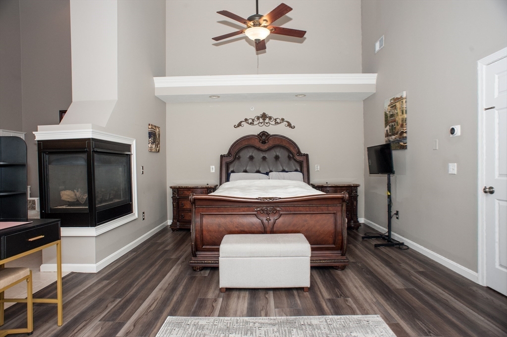 1501 Old Bridge Lane, Unit 1501 Bellingham, MA 02019 - Photo 23 of 42 a living room with furniture and a fireplace