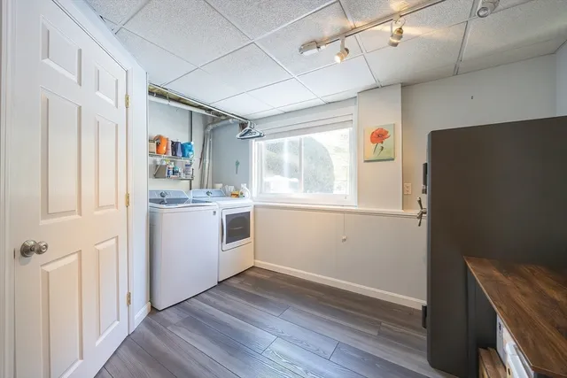 a bathroom with a sink a toilet a shower and a mirror