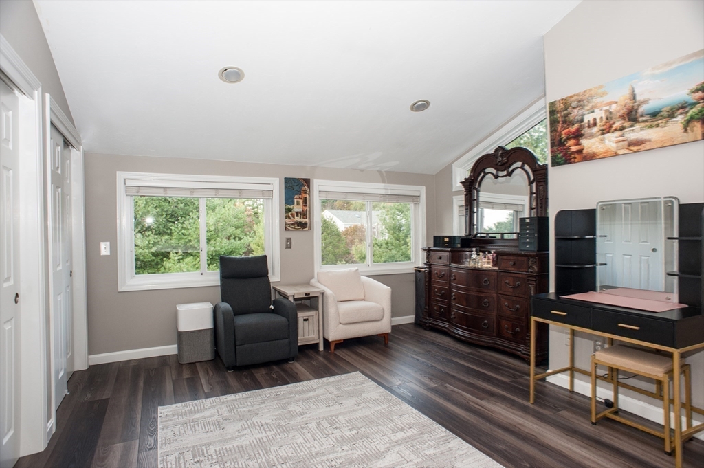 1501 Old Bridge Lane, Unit 1501 Bellingham, MA 02019 - Photo 25 of 42 a living room with furniture and a window