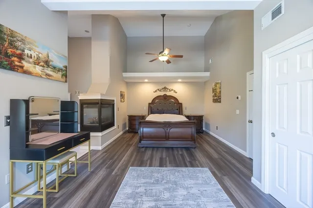 a view of a house with a barbeque and trees