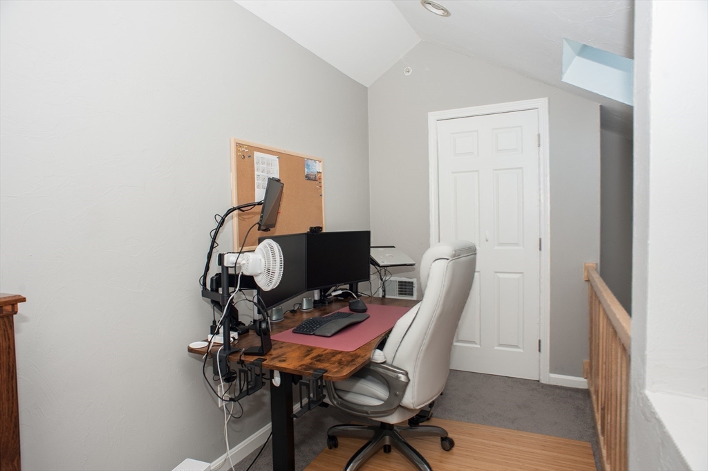 1501 Old Bridge Lane, Unit 1501 Bellingham, MA 02019 - Photo 31 of 42 a view of a workspace with furniture and wooden floor