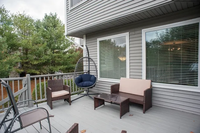 a view of a house with backyard porch and sitting area