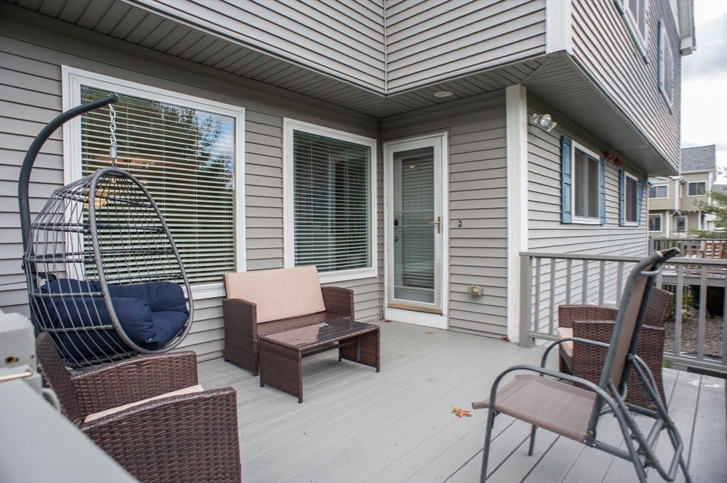 1501 Old Bridge Lane, Unit 1501 Bellingham, MA 02019 - Photo 36 of 42 a building outdoor space with patio furniture