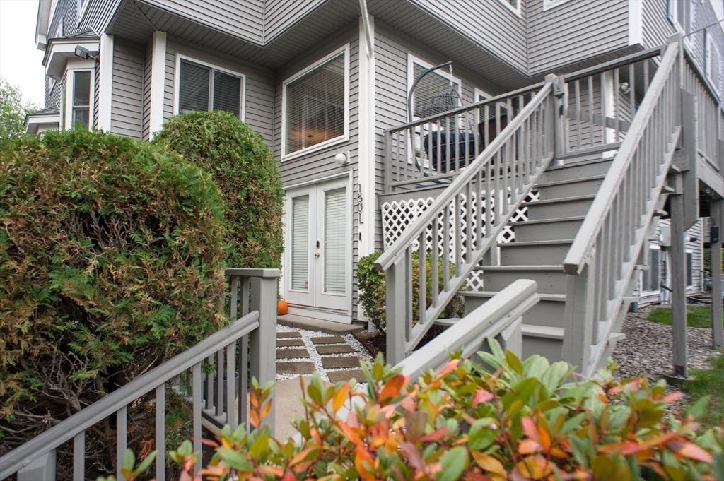 1501 Old Bridge Lane, Unit 1501 Bellingham, MA 02019 - Photo 38 of 42 a balcony view with wooden fencing