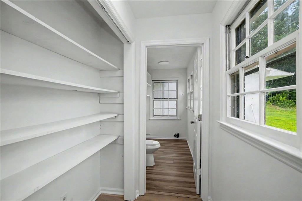 1605 Shackelford Road Griffin, GA 30224 - Photo 17 of 51 a view of a hallway with wooden floor and windows