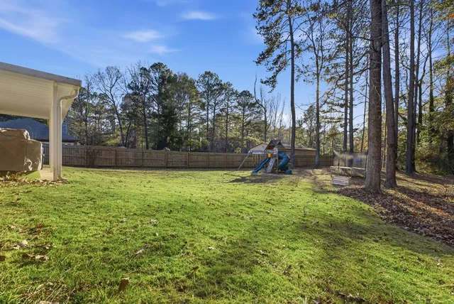 a view of a backyard with a trampoline
