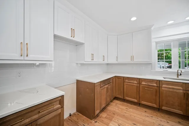 a kitchen with a sink and cabinets
